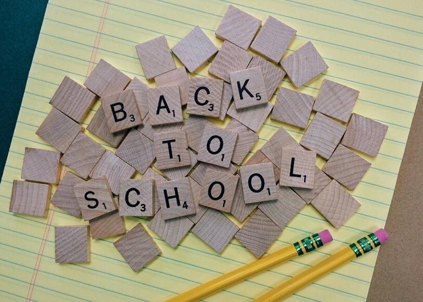 Back to School Spelled out on a Sheet of Paper in Scrabble Tiles