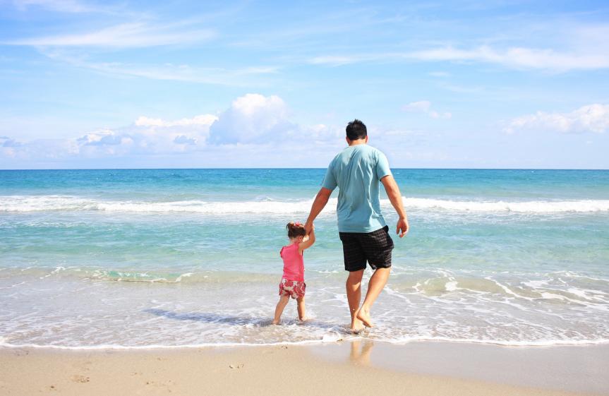 Father and Daughter in Sea at the Beach