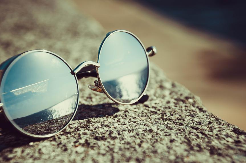 Pair of Sunglasses on Rocks