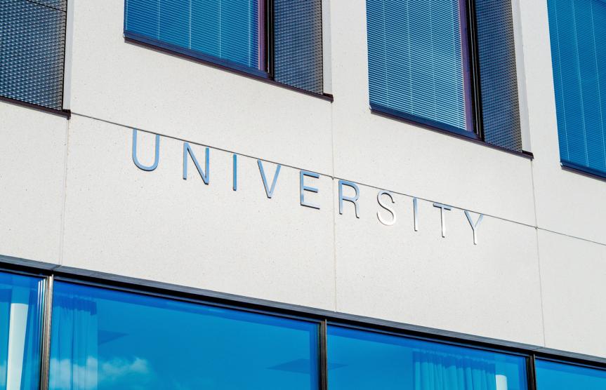 University Sign On a Building